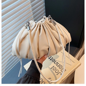 Detail of off-white pleated cloud bag showing leather texture and silver metal hooks