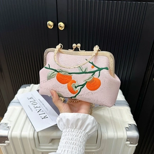 Pink silk embroidered handbag with orange persimmon patterns and gold ring handle