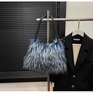 Detail of blue and white long faux fur shoulder bag with black leather strap