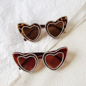 Sparkly rhinestone heart-shaped sunglasses in leopard and deep brown frames for girls