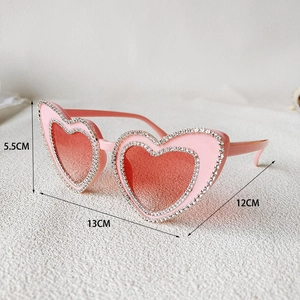 Detailed view of pink heart-shaped rhinestone sunglasses with specific size measurements