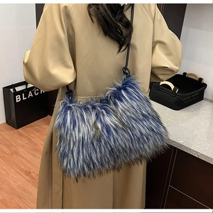 Blue and white faux fur shoulder bag worn with a khaki trench coat for winter style