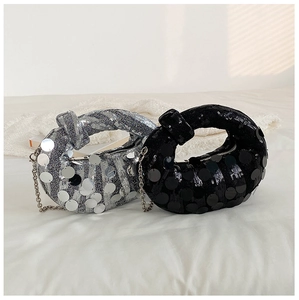 Detailed view of silver and black sequin crescent bags with elegant chain straps