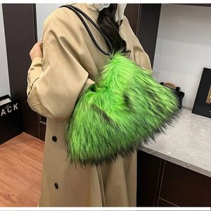 Detail of fluffy faux fur tote bag in vibrant grass green with slim black shoulder strap