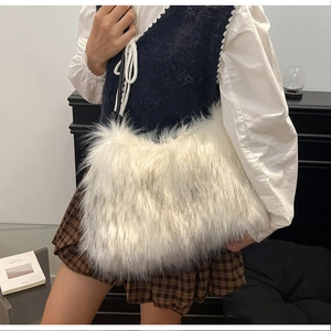 Detail of white long faux fur texture on a stylish women shoulder bag with plush finish