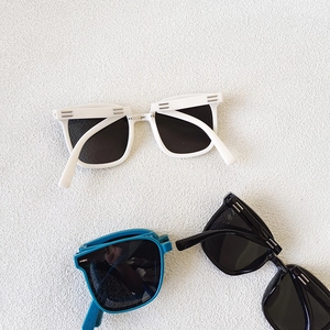 Kids polarized square sunglasses in white, black and blue with metal accents