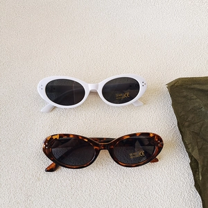 Retro oval kids sunglasses in white and tortoiseshell frame with UV400 protection lenses