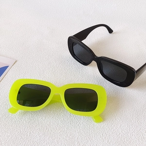 Retro oval wide frame sunglasses in black and neon yellow with UV protection