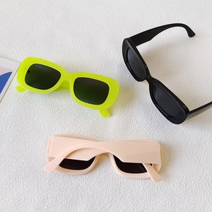 Unisex oval rectangular sunglasses in neon green, black, and nude colors with thick frames