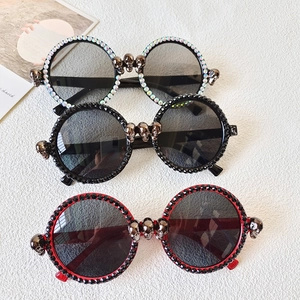 Gothic round rhinestone sunglasses with 3D skull ornaments and sparkle crystal trim