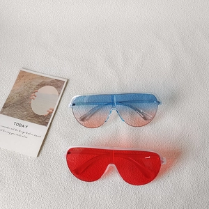 Fashionable oversized wrap around sunglasses with blue pink gradient and red lenses