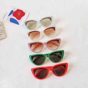 Cat eye sunglasses with hollow metal brow detail in blue, pink, green, red and white