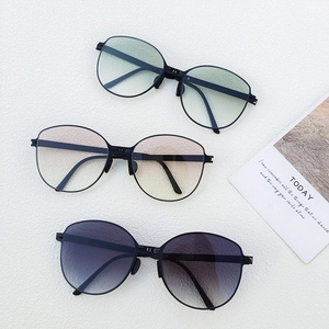 Three pairs of folding sunglasses with gradient lenses and slim black frames
