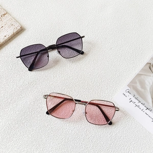 Close-up of vintage square metal frame kids sunglasses in purple and pink tones