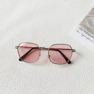 Detail of pink transparent lenses and slim silver metal frames for kids sunglasses