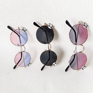 Three pairs of round kids sunglasses with metal frames and cute panda cartoon accents