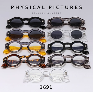 Variety of round retro sunglasses and optical frames with metal rivets in nine colors
