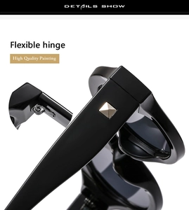Detail of sunglasses flexible hinges and golden square rivets on black glossy frames