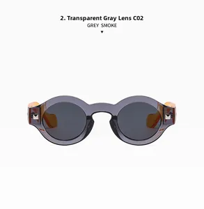 Detailed view of retro round grey frame sunglasses with amber temples and silver rivets