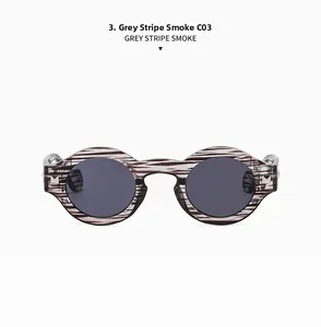 Detail of retro round grey stripe sunglasses with silver square rivets on the frame