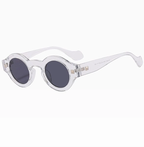 Detailed close-up showing transparent round frames and gold rivet accents on sunglasses