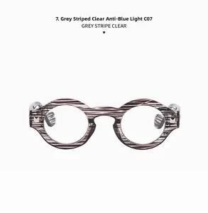 Detail view of round anti-blue light glasses with grey striped frames and clear lenses