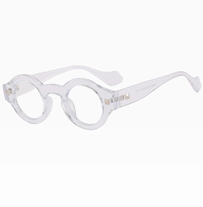 Macro view of clear round frame glasses with metallic rivets and temple detail