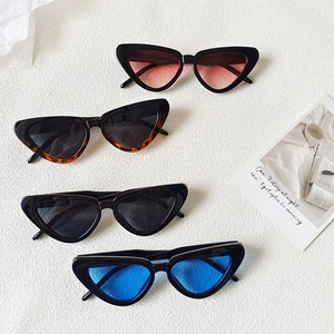 Vintage cat-eye sunglasses for women in tortoiseshell, red, blue, and black frame options