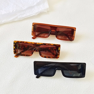Oversized one-piece rectangle sunglasses in brown, tortoiseshell, and black colors