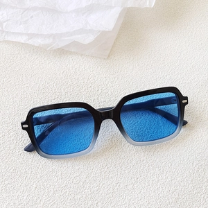 Detail of rectangular leopard print sunglasses with blue lenses and gradient frames