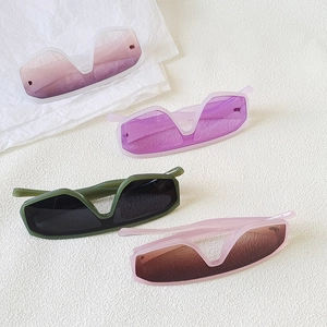 Oversized one-piece sunglasses with unique V-cut lenses in multiple gradient fashion colors
