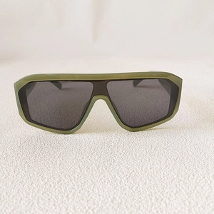 Front view of oversized geometric sunglasses with olive green frames and dark grey lenses