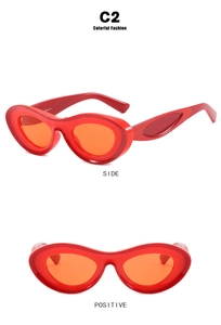 Detail of red irregular wavy sunglasses frame with orange lenses from side and front views