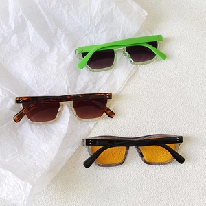 Three pairs of vintage rectangle sunglasses in candy colors with chic rivet accents