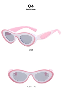 Detail view of pink and white two-tone cat eye sunglasses with dark grey lenses
