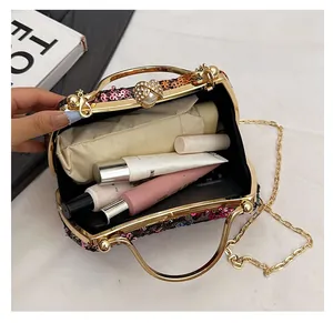 Macro view of sequin evening bag interior with spacious storage for phone and cosmetics