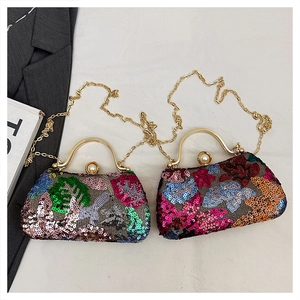 Detail of floral sequin evening bag with gold handle and pearl clasp fastener