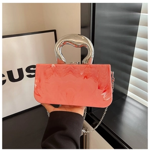 Pink marble acrylic evening clutch with sculptural silver handle and chain strap