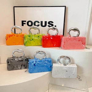 Chic acrylic evening clutch bag with marble texture and metallic horseshoe handle