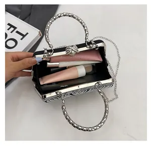 Detail of black velvet clutch with silver rhinestones and spacious inner compartment