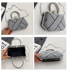 Detail of silver rhinestone clutch bag with pearl clasp and metal ring handle