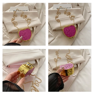 Detailed views of heart-shaped glitter mini bag with gold chain and sequin texture