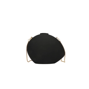 Minimalist matte black pebble-shaped acrylic evening bag with a gold metal chain strap