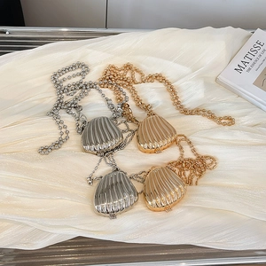 Mini shell-shaped metallic crossbody bags in gold and silver with elegant bead chain straps