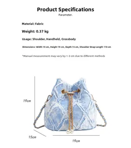 Blue denim bucket bag with quilted patterns and dimensions 19x19x15cm with chain strap