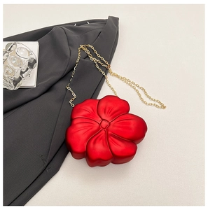 Detailed top view of red 3D flower mini crossbody bag with a slim golden metal chain