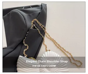 Exquisite gold chain strap detail on white shell-textured acrylic clutch bag