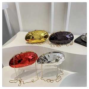 Detailed view of glossy acrylic oval clutch bags with pleated metallic finish in four colors