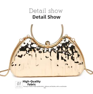 Macro detail of golden evening bag with ice crack texture and metallic round handle