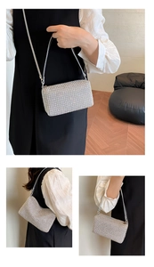 Detailed macro view of sparkly silver rhinestone handbag with elegant metal chain strap